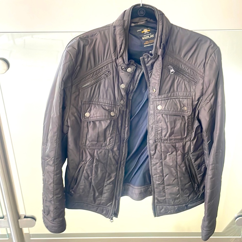 Super Lightweight Replay jacket. Lots of pockets. Somewhat water resistant.